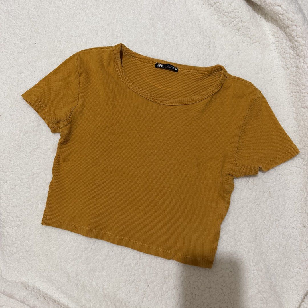 Mustard Yellow Ribbed T-Shirt Small (Category: Shirts) located in Cabuyao City. Submitted by beverlybella (Listing ID 1457686496, Image 2). Description: - Ribbed texture all over - Short sleeves and rounded neckline - Ideal for casual wear or layering.