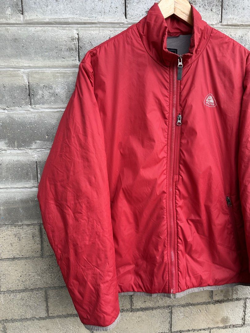 Nike ACG Layer 3 Outer Shell Zip-Up Jacket (Category: Coats, Jackets and Outerwear) located in Urdaneta. Submitted by redeemedcollective (Listing ID 1457644429, Image 2). Description: An authentic archival piece from Nike’s iconic late-90s to early-2000s ACG (All Conditions Gear) line. Built as a versatile Layer 3 outer shell, this jacket features a durable red exterior paired with a breathable grey mesh interior and secure utility pockets. A cla