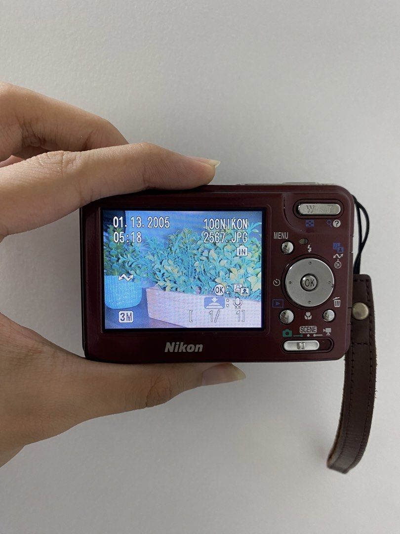 Nikon COOLPIX S3 Digital Camera - Red (Category: Cameras) located in Manila. Submitted by kerrie_owns (Listing ID 1457632417, Image 3). Description: Red Nikon COOLPIX S3 - Compact point-and-shoot style - Older model (screen date: 01.13.2005) - Includes wrist strap & Universal charger Important note: The camera is fully functioning (Flash, Red flash, and buttons all working). Sadly It cannot read SD cards due to a mother board issue (Aa per techni