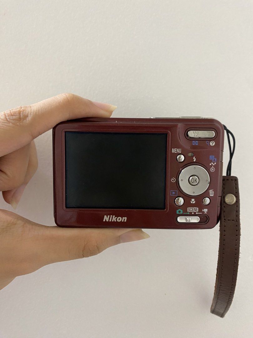 Nikon COOLPIX S3 Digital Camera - Red (Category: Cameras) located in Manila. Submitted by kerrie_owns (Listing ID 1457632417, Image 2). Description: Red Nikon COOLPIX S3 - Compact point-and-shoot style - Older model (screen date: 01.13.2005) - Includes wrist strap & Universal charger Important note: The camera is fully functioning (Flash, Red flash, and buttons all working). Sadly It cannot read SD cards due to a mother board issue (Aa per techni
