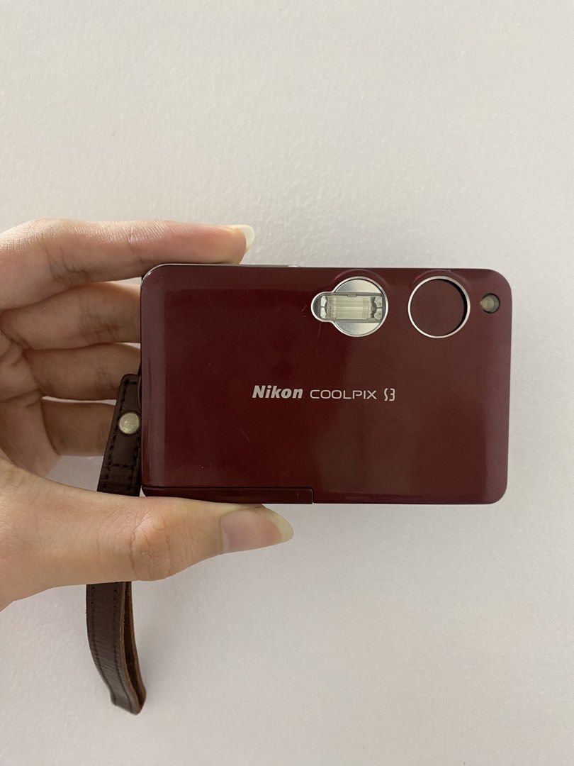 Nikon COOLPIX S3 Digital Camera - Red (Category: Cameras) located in Manila. Submitted by kerrie_owns (Listing ID 1457632417, Image 1). Description: Red Nikon COOLPIX S3 - Compact point-and-shoot style - Older model (screen date: 01.13.2005) - Includes wrist strap & Universal charger Important note: The camera is fully functioning (Flash, Red flash, and buttons all working). Sadly It cannot read SD cards due to a mother board issue (Aa per techni