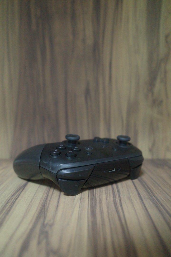 Nintendo Switch Pro Controller (Category: Controllers) located in Singapore. Submitted by zhyap828 (Listing ID 1457518968, Image 2). Description: Black Nintendo Switch Pro Controller. Bought 3 years ago, everything still in perfect condition..