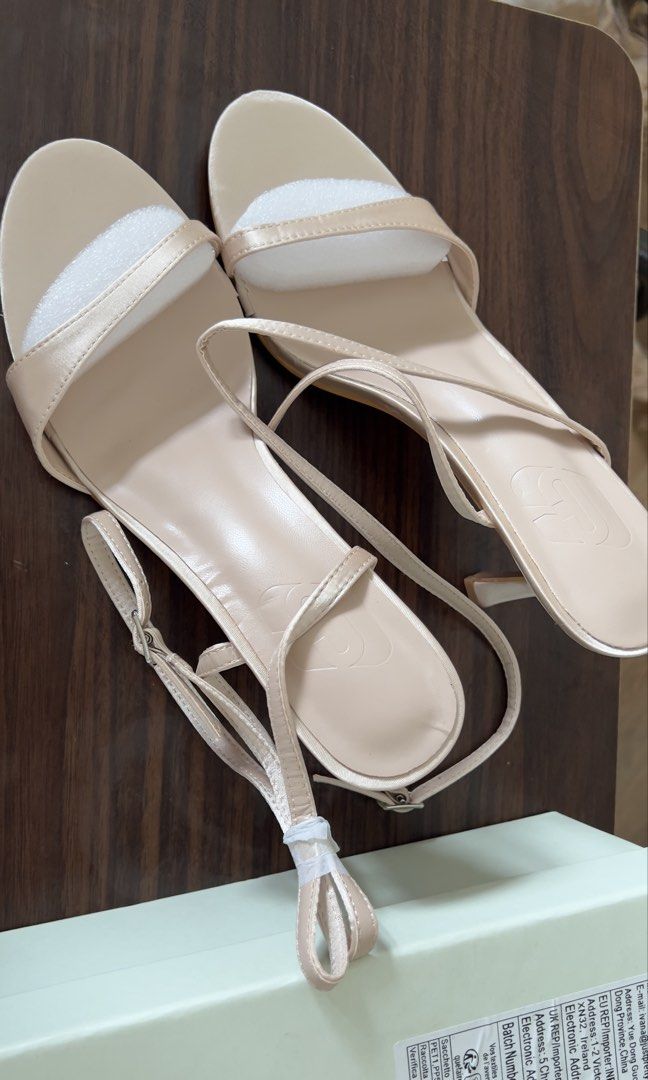 Nude Strappy Heeled Sandals (Category: Heels) located in Cebu City. Submitted by shopgalora (Listing ID 1457545685, Image 1). Description: - Never been used; too large for me - Nude strappy heeled sandals - Delicate straps with buckle closure - Kitten heel height - Satin-like material - Comes with original box - Super cute for dressing up!.