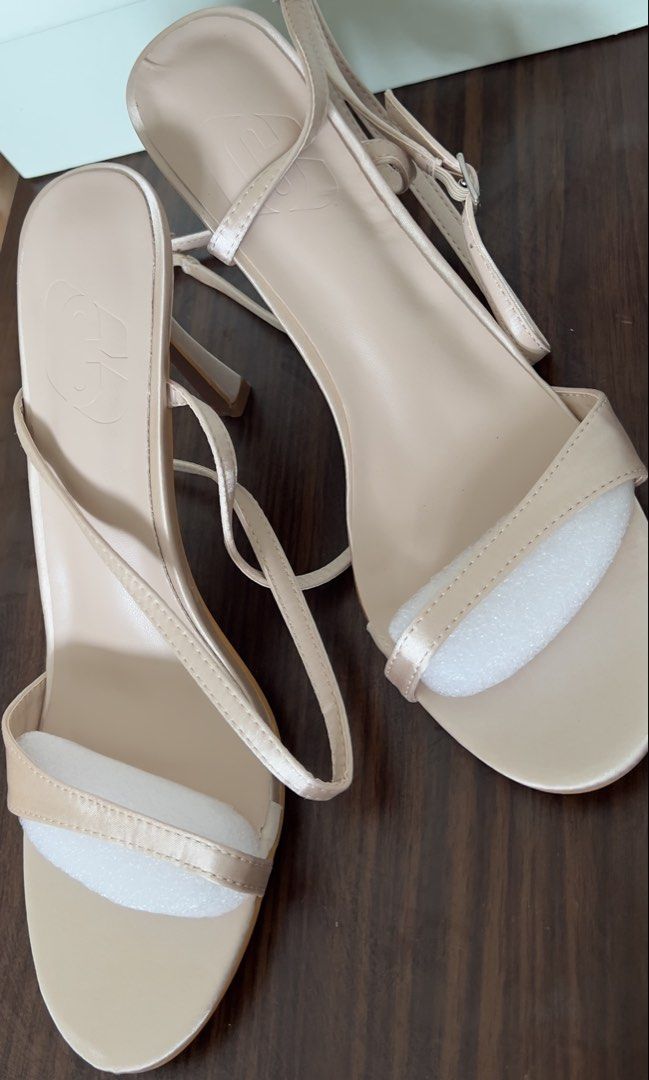Nude Strappy Heeled Sandals (Category: Heels) located in Cebu City. Submitted by shopgalora (Listing ID 1457545685, Image 3). Description: - Never been used; too large for me - Nude strappy heeled sandals - Delicate straps with buckle closure - Kitten heel height - Satin-like material - Comes with original box - Super cute for dressing up!.