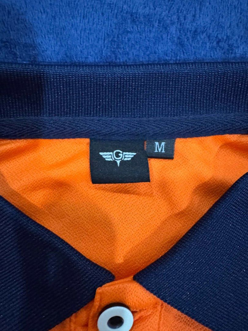 Orange Polo Shirt with Navy Collar (Category: Tshirts & Polo Shirts ) located in Muntinlupa City. Submitted by stark880 (Listing ID 1457632087, Image 2). Description: Orange Polo Shirt Authentic Medium Size Rfs: does not fit.