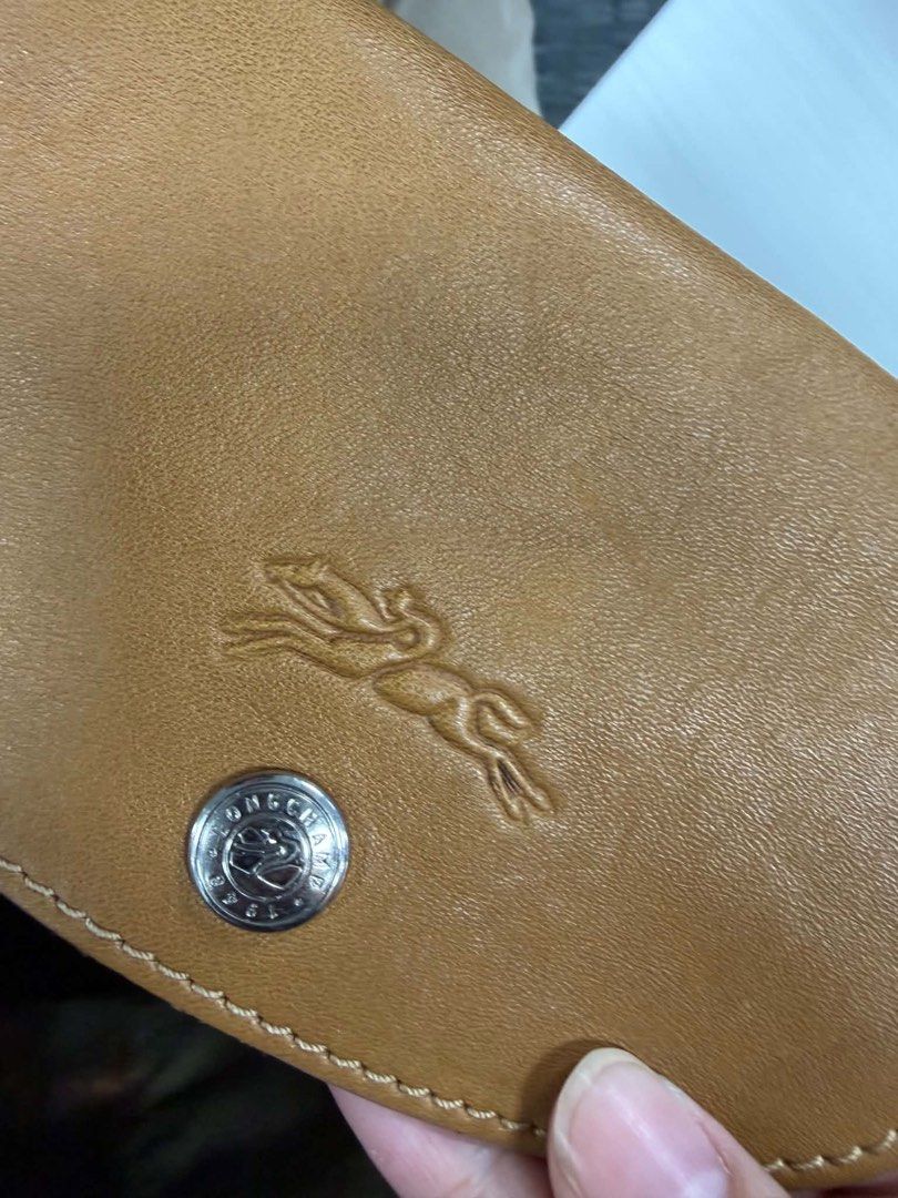 Original Longchamp Modele Depose - Brown Leather (Category: Luxury Bags & Wallets) located in Valenzuela. Submitted by polalalala (Listing ID 1457587536, Image 2). Description: - Authentic Longchamp travel bag - Rich cognac-colored leather - Comfortable top handles - Detachable shoulder strap for versatility - Original - Foldable - Ample space for all your essentials - Perfect for weekend getaways or gym sessions.