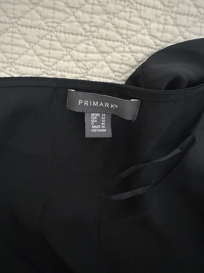 Primark Black Satin Long Sleeve Tie Front Wrap Top (Category: Blouses) located in Subic. Submitted by ruffa_assorted_item (Listing ID 1457522567, Image 3). Description: - Primark black satin wrap top - Size UK 14 - Long sleeves - Tie front detail - Versatile: wear tied or open - Perfect for dressing up or down.