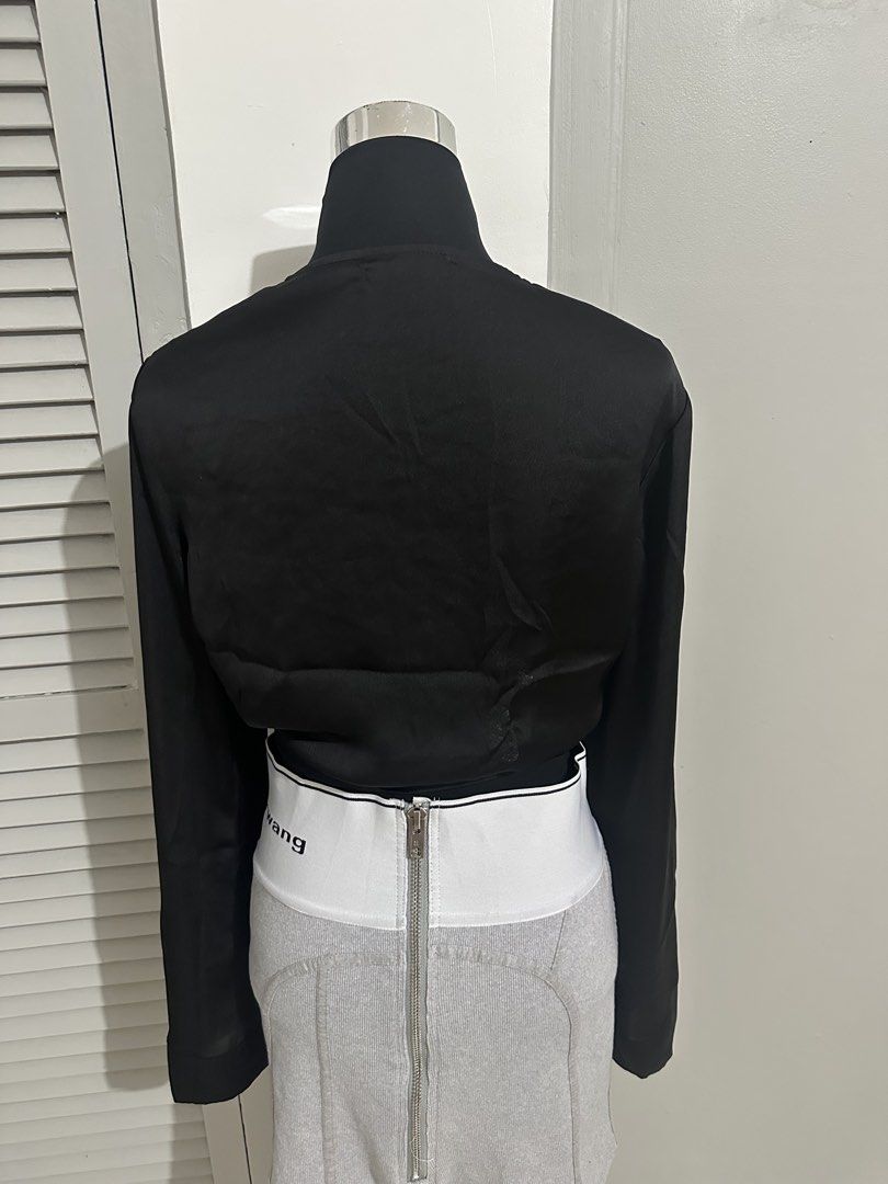 Primark Black Satin Long Sleeve Tie Front Wrap Top (Category: Blouses) located in Subic. Submitted by ruffa_assorted_item (Listing ID 1457522567, Image 2). Description: - Primark black satin wrap top - Size UK 14 - Long sleeves - Tie front detail - Versatile: wear tied or open - Perfect for dressing up or down.