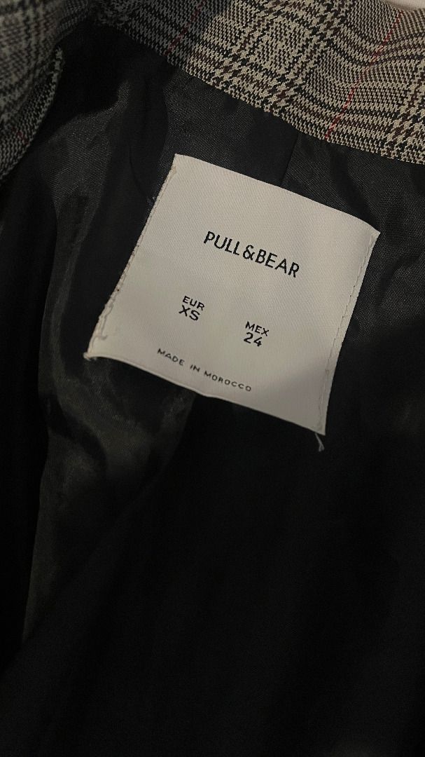 Pull & Bear Plaid Double-Breasted Blazer (Category: Coats, Jackets and Outerwear) located in Bacoor. Submitted by nana_yuzu (Listing ID 1457526567, Image 2). Description: - Stylish grey and black plaid pattern - Single button front closure - Two buttons on each cuff - Fully lined for comfort - Versatile for layering over tops or dresses - Ideal for both work and casual occasions.