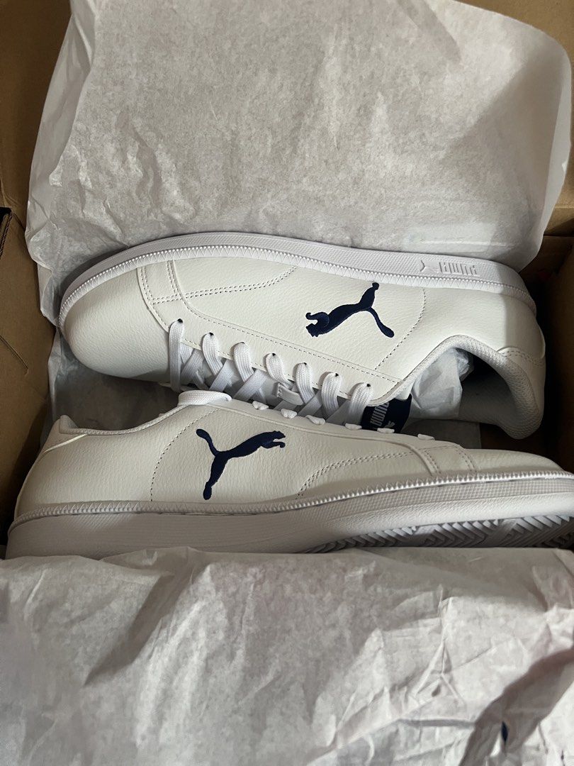Puma Smash V2 Leather Sneakers White Navy (Category: Sneakers) located in Quezon City. Submitted by mr_luiboi09 (Listing ID 1457592871, Image 3). Description: - Classic white Puma sneakers - Navy blue accents - Iconic Puma cat logo on side and tongue - White rubber sole - Includes original Puma box - Ideal for casual wear BRAND NEW Original Price: 3400 RFS: Wrong sizing.