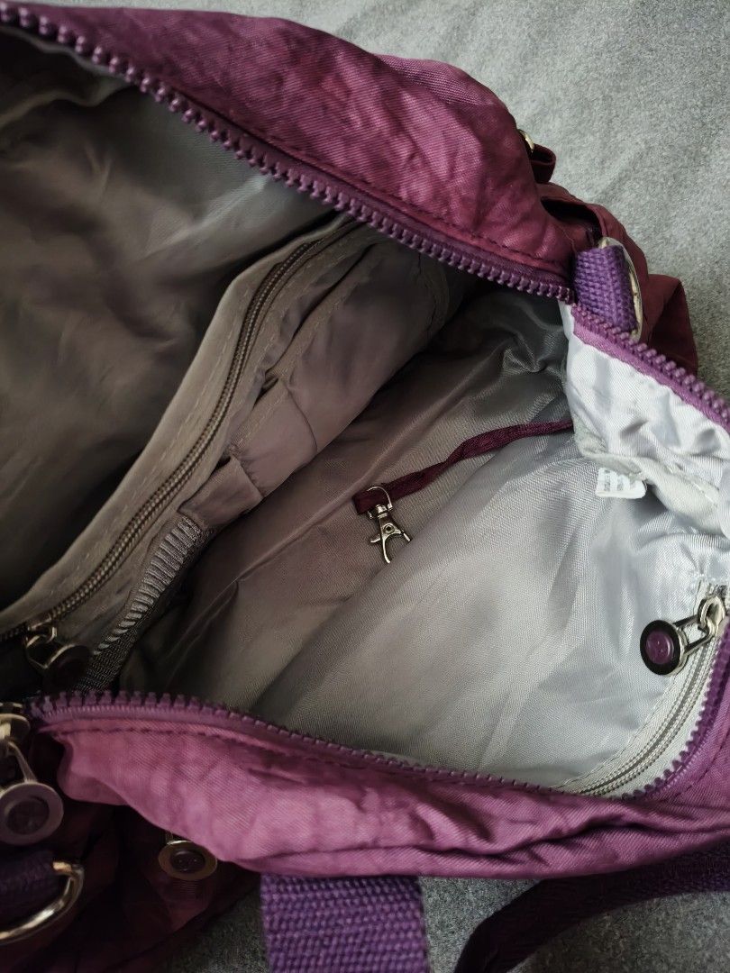 Purple Shoulder Bag with Multiple Pockets (Category: Shoulder Bags) located in Marikina City. Submitted by cloudycookie22 (Listing ID 1457586450, Image 3). Description: - Cute purple shoulder bag - Multiple front pockets for easy access - Zippered main compartment - Interior zippered pocket and small pouch - Ideal for everyday use.