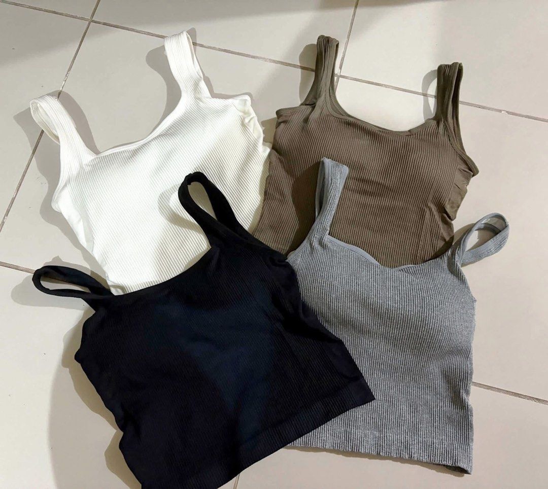 Ribbed Tank Tops - White, Black, Grey, Brown (Category: Sleeveless) located in Cabanatuan. Submitted by blessjewel_ (Listing ID 1457659762, Image 1). Description: - Set of 4 ribbed tank tops - Colors included: White, Black, Grey, Brown - Comfortable and stretchy fabric - Versatile square neckline design - Ideal for layering or wearing on its own - Essential wardrobe basics.