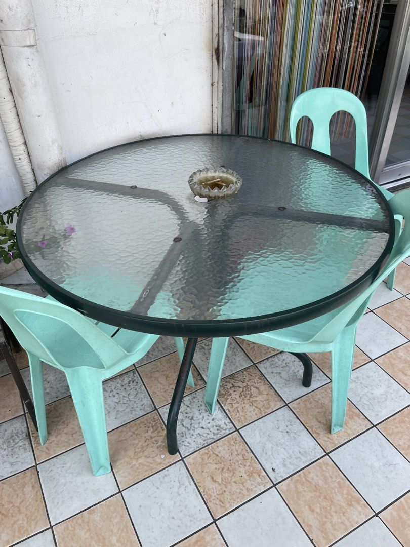 Round Glass Table / umbrella table (Category: Tables & Sets) located in Manila. Submitted by rosechan429 (Listing ID 1457594690, Image 2). Description: - Round glass top table with a sturdy metal base - Textured glass surface for a unique look - Suitable for both indoor and outdoor spaces - Perfect for small patios, balconies, or dining areas 2 umbrella table 43inches in diameter.