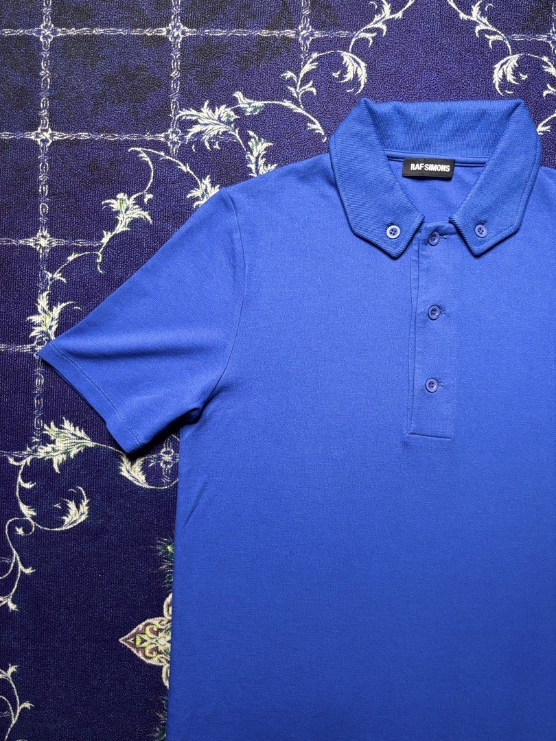 Royal Blue Raf Simons Button-down Collar Polo Shirt (Category: Luxury Apparel) located in Valenzuela. Submitted by telagram (Listing ID 1457687186, Image 2). Description: Width - 18.6 Length - 26 Shoulder - 16 Sleeves - 9.5.