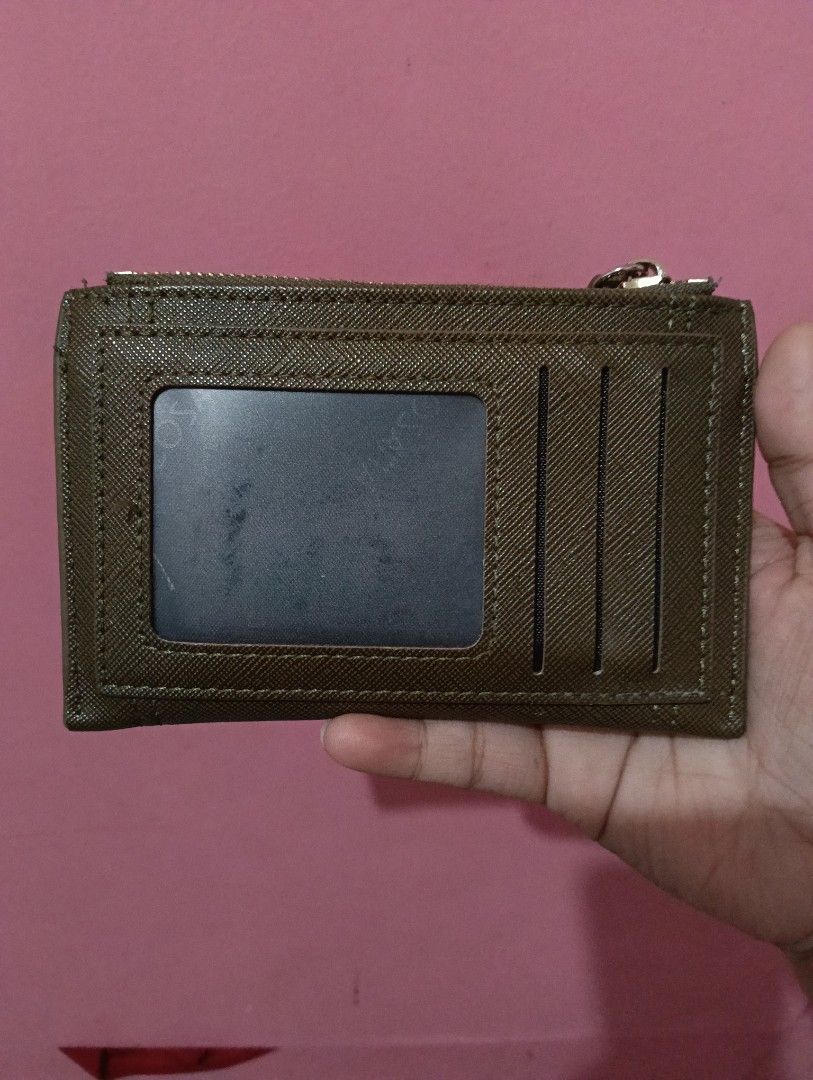 Secosana Card Holder with Zipper Pocket (Category: Wallets & Card holders) located in Manila. Submitted by pashibee.thrifts (Listing ID 1457643715, Image 2). Description: - Secosana card holder in a stylish olive green. - Zippered compartment for coins or folded bills. - Multiple slots for your cards. - Clear ID window on the back for easy access. - Compact and practical for everyday organization..