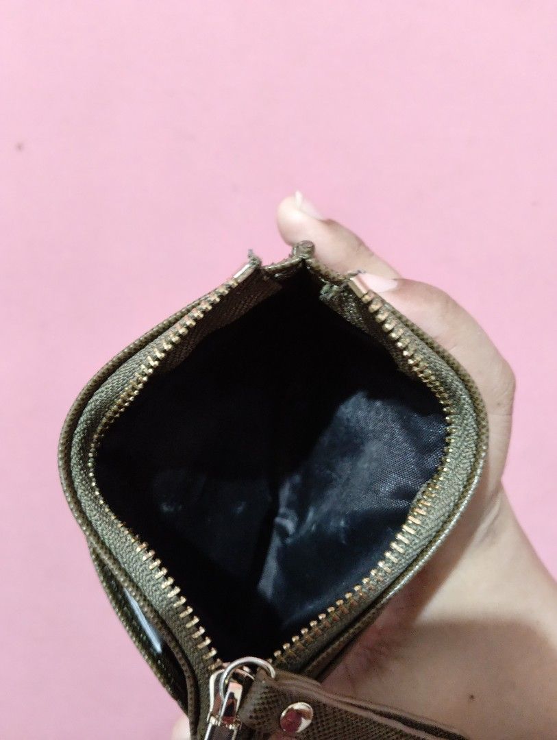 Secosana Card Holder with Zipper Pocket (Category: Wallets & Card holders) located in Manila. Submitted by pashibee.thrifts (Listing ID 1457643715, Image 3). Description: - Secosana card holder in a stylish olive green. - Zippered compartment for coins or folded bills. - Multiple slots for your cards. - Clear ID window on the back for easy access. - Compact and practical for everyday organization..