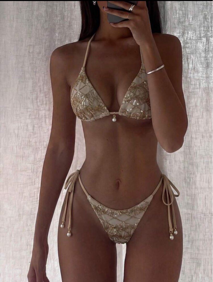 Sparkly Embellished Triangle Bikini with Pearls (Category: Bikinis & Swimsuits) located in Manila. Submitted by yo_hanna (Listing ID 1457533320, Image 1). Description: - Eye-catching beaded bikini set with sequin details. - Features a triangle top with a beautiful pearl accent. - Bikini bottoms have adjustable tie sides and elegant pearl details. - Ideal for beach vacations and pool parties. - A truly stunning and unique design..