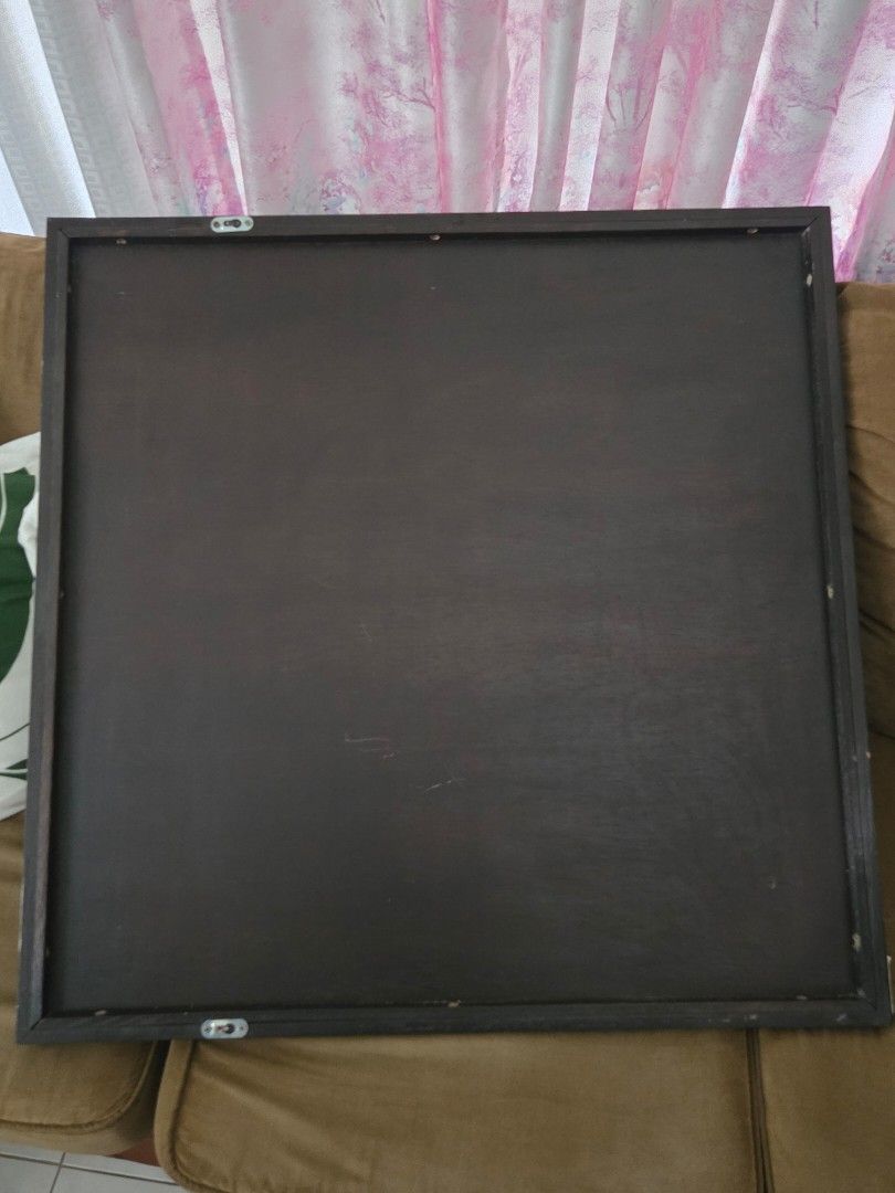 Square Wall Mirror with Interlocking Circle Design (Category: Mirrors) located in Rizal. Submitted by cedseller7-35557 (Listing ID 1457636693, Image 2). Description: - Square wall mirror with a sleek black frame. - Features a unique interlocking circle design overlay. - Dark wood panel backing. - Ready to hang with included hooks. - Adds a decorative touch to any room..