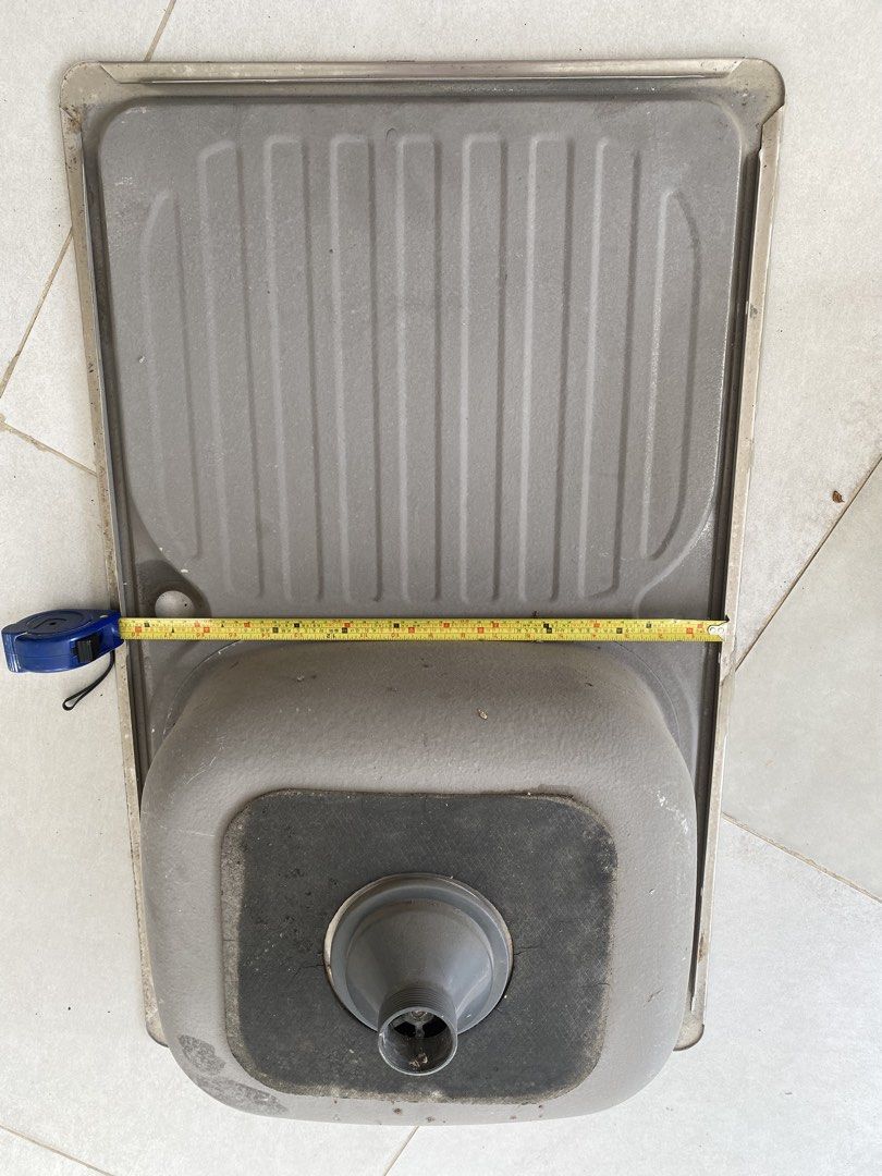 Stainless Steel Kitchen Sink with Drainer (Category: Bathroom & Kitchen Fixtures) located in Quezon City. Submitted by gab_tan (Listing ID 1457600885, Image 3). Description: - Single bowl stainless steel kitchen sink - Includes drainer on the right side - Approximate measurements: 80cm x 45cm - Ideal for kitchen renovations or replacements.