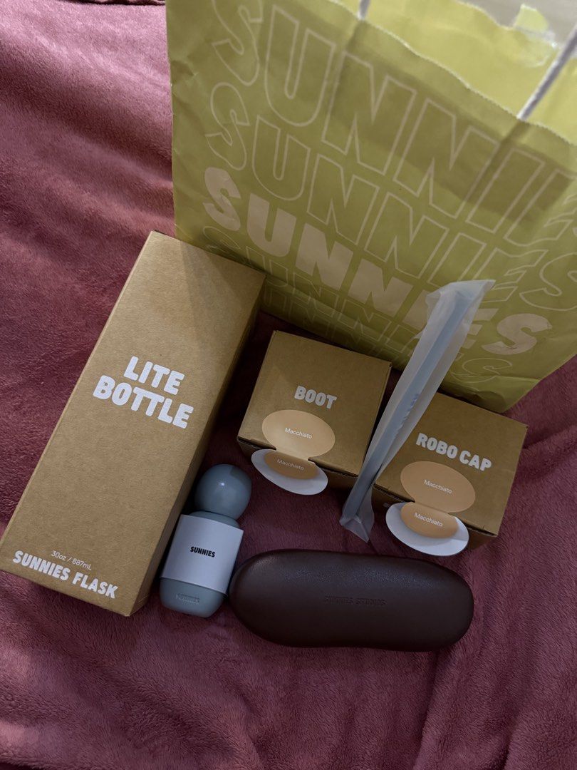 Sunnies Flask Lite Bottle, Boot, Robo Cap, and Case (Category: Water Bottles & Tumblers) located in Manila. Submitted by lexie.xoxo (Listing ID 1457662318, Image 1). Description: - Sunnies Flask Lite Bottle (30oz/887mL) - Color: Macchiato - Includes: Boot accessory (Macchiato) - Includes: Robo Cap accessory (Macchiato) - Includes: Dark brown Sunnies Studios case - Includes: Straw - All items are authentic Sunnies Studios products..