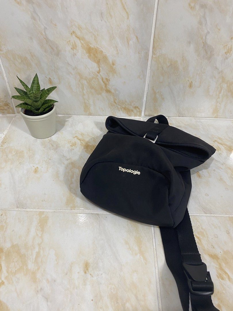Topologie Black Roll Top Bag (Category: Backpacks) located in Manila. Submitted by haveago0dthrift (Listing ID 1457630535, Image 2). Description: - Brand: Topologie - Color: Black - Style: Roll top backpack - Closure: Buckle - Features: Adjustable straps, interior pockets for organization - Ideal for: Everyday use, travel - Design: Clean and simple.