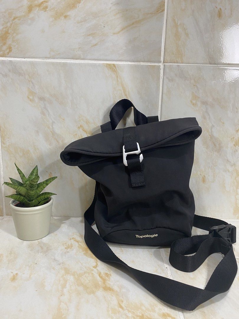 Topologie Black Roll Top Bag (Category: Backpacks) located in Manila. Submitted by haveago0dthrift (Listing ID 1457630535, Image 1). Description: - Brand: Topologie - Color: Black - Style: Roll top backpack - Closure: Buckle - Features: Adjustable straps, interior pockets for organization - Ideal for: Everyday use, travel - Design: Clean and simple.