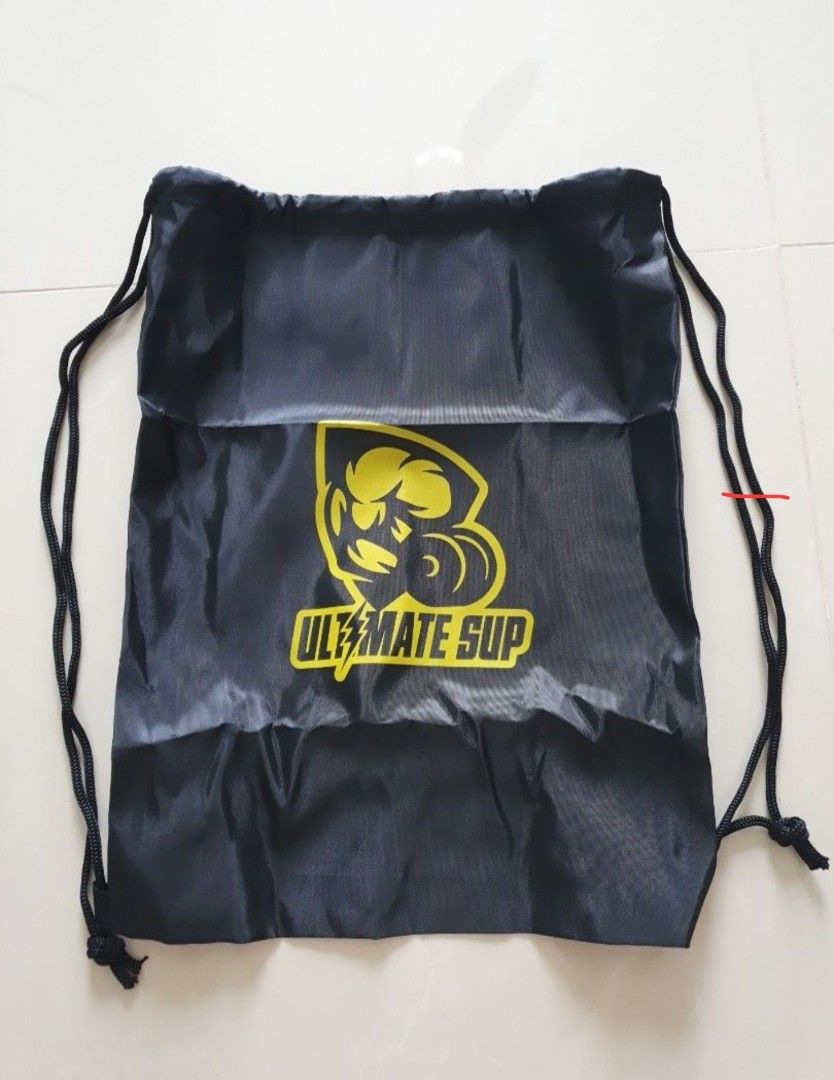 Ultimate Sup drawstring backpack (Category: Backpacks) located in Singapore. Submitted by cheung_jude (Listing ID 1457524790, Image 1). Description: - Brand: Ultimate Sup - Type: Drawstring backpack - Color: Black - Design: Features a prominent yellow Ultimate Sup logo - Condition: Good, pre-loved - Ideal for: Gym, sports, daily errands.