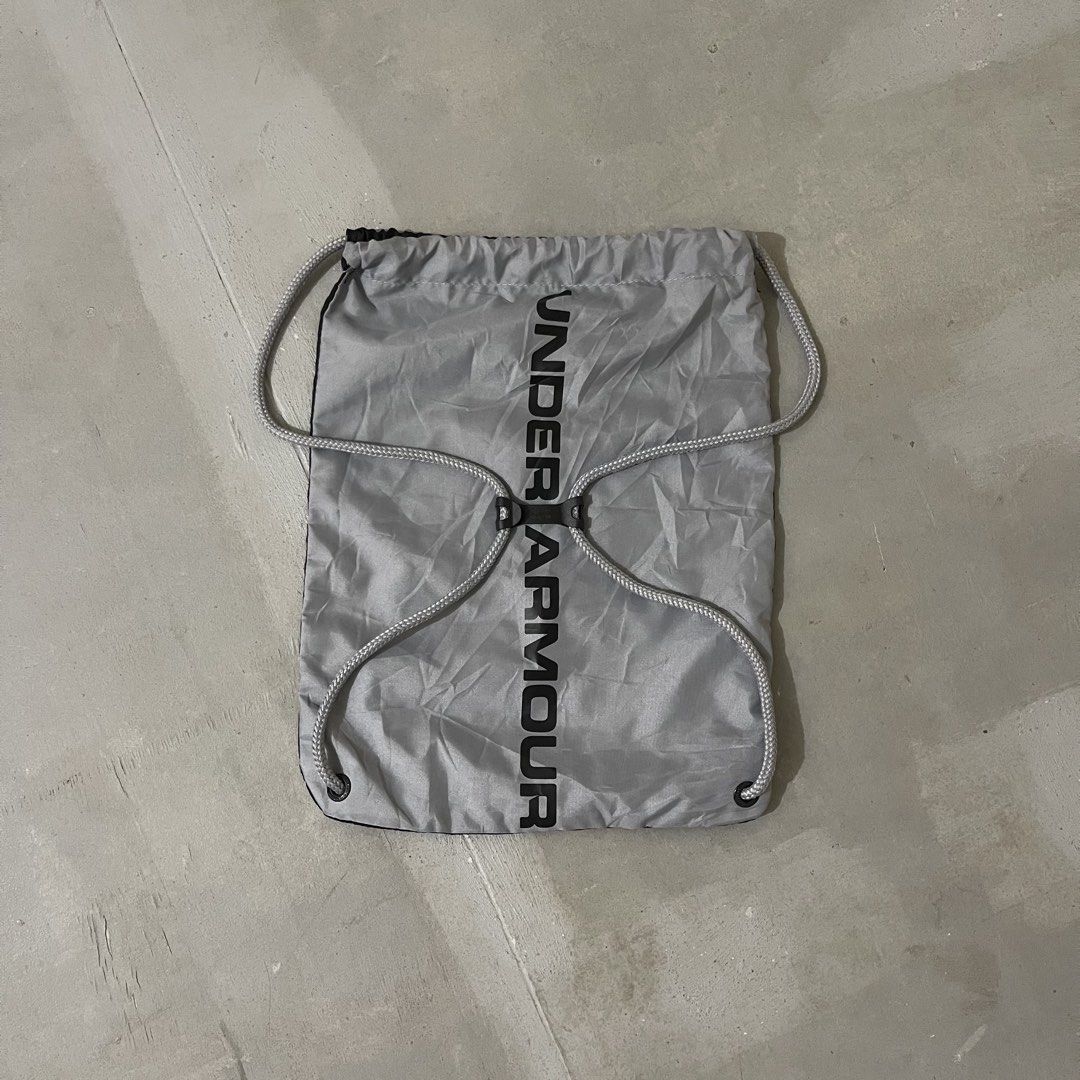Under Armour Black Grey Drawstring Bag (Category: Backpacks) located in Manila. Submitted by bravebird_164362 (Listing ID 1457655106, Image 2). Description: UA BACK DRAWSTRING BAG LIKE NEW NO FLAWS DM.