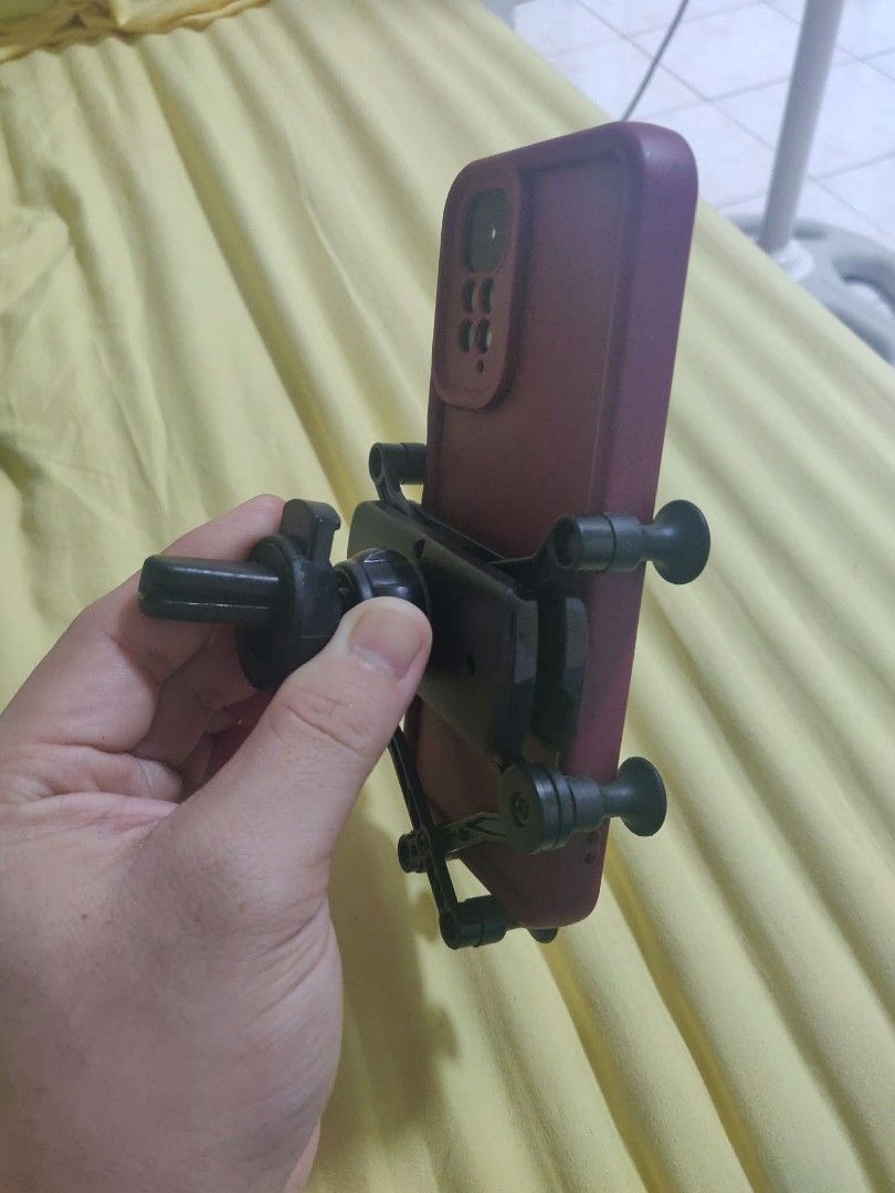 Universal Car Air Vent Phone Mount (Mechanical Gravity Clamp) (Category: Mounts & Holders) located in San Jose del Monte. Submitted by mrs.ca01 (Listing ID 1457668660, Image 2). Description: FOR SALE: Universal Car Air Vent Phone Mount (Mechanical Gravity Clamp) Price: ₱50 FIXED (Super cheap, clearing out space) Condition: Preloved, 100% working condition. Spring mechanisms and gravity clamps move smoothly. No broken clips or cracks. Clean and re