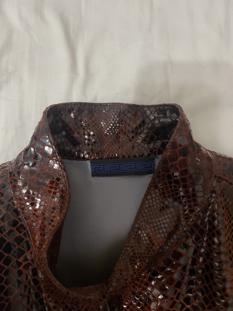 Versace Python Print Leather Jacket (Category: Coats, Jackets and Outerwear) located in Singapore. Submitted by baldnuggets444 (Listing ID 1457682318, Image 3). Description: • Colour: Burgundy • Good condition, never worn it out • Resells for 3K on ebay 🥶.