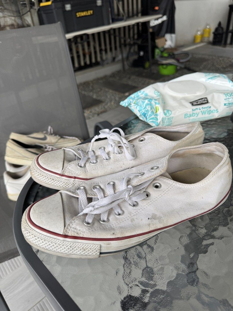White Converse Chuck Taylor All Star Low Top Sneakers (Category: Sneakers) located in Cainta. Submitted by akmdq (Listing ID 1457586049, Image 1). Description: - Classic white Converse Chuck Taylor low tops - Durable canvas material - Iconic red stripe on the sole - Laces included - Soles show some wear but retain good grip - Ideal for everyday casual wear - A wardrobe essential.