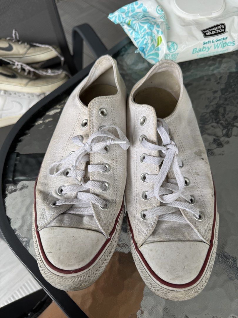 White Converse Chuck Taylor All Star Low Top Sneakers (Category: Sneakers) located in Cainta. Submitted by akmdq (Listing ID 1457586049, Image 3). Description: - Classic white Converse Chuck Taylor low tops - Durable canvas material - Iconic red stripe on the sole - Laces included - Soles show some wear but retain good grip - Ideal for everyday casual wear - A wardrobe essential.