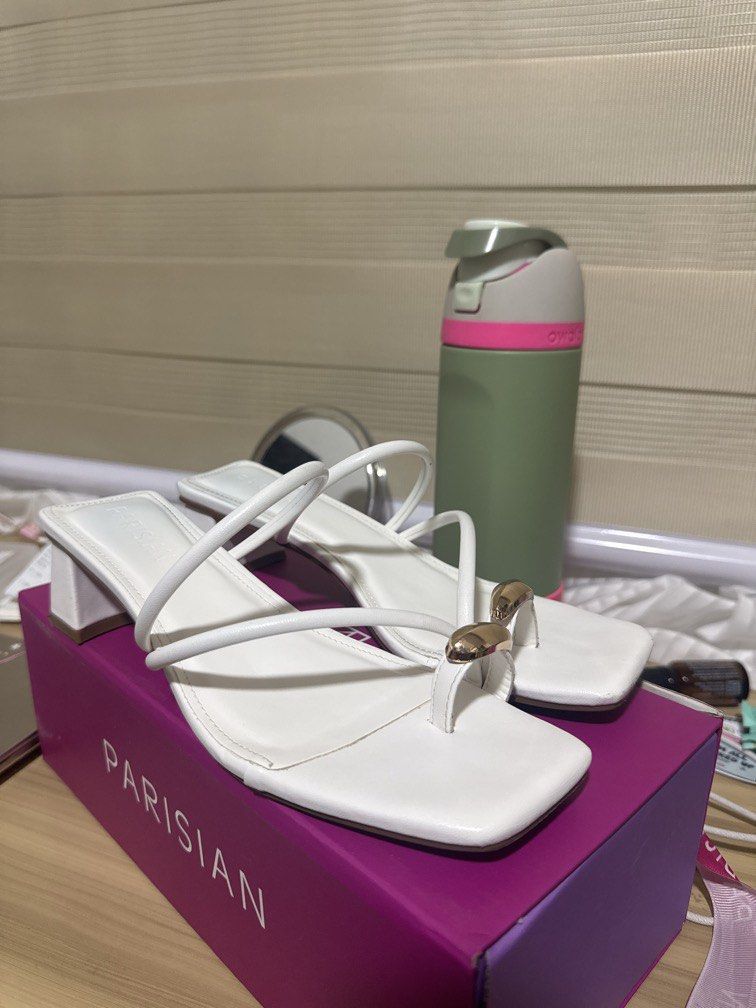 White Heels (Category: Heels) located in Manila. Submitted by declutterdoctor (Listing ID 1457646682, Image 2). Description: - Parisian white heeled sandals - Used 3x only - Stylish square toe - Delicate thin straps with a gold accent - Comfortable block heel - Easy slip-on design - Versatile for dressing up or down.