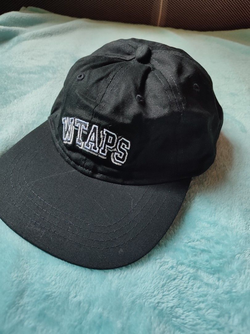 WTAPS Cap Black Cotton Adjustable Strap (Category: Caps & Hats) located in Puerto Princesa. Submitted by thriftedsoulsy2k (Listing ID 1457628032, Image 1). Description: - Black WTAPS cap - Made from durable cotton - Features embroidered WTAPS logo on front and back - Adjustable strap with metal buckle for a custom fit - Size X00 - Ideal for everyday wear.