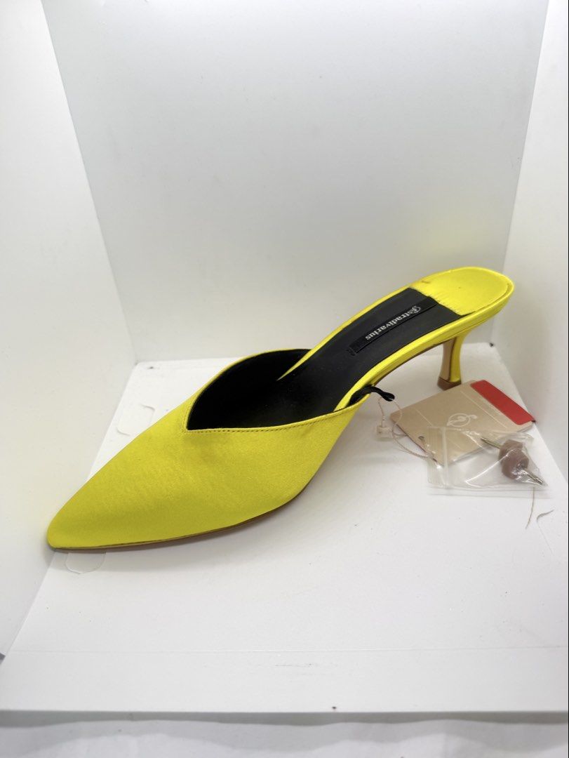Yellow heeled mules (Category: Heels) located in Mandaluyong City. Submitted by cherryspicks (Listing ID 1457626488, Image 2). Description: Never used with tag. Comfortable height and fit . Size is 38, 7-7.5.