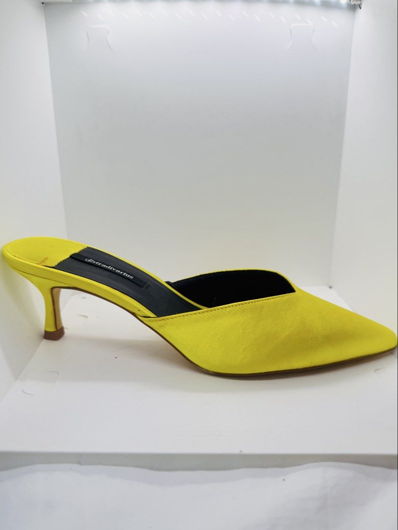 Yellow heeled mules (Category: Heels) located in Mandaluyong City. Submitted by cherryspicks (Listing ID 1457626488, Image 1). Description: Never used with tag. Comfortable height and fit . Size is 38, 7-7.5.