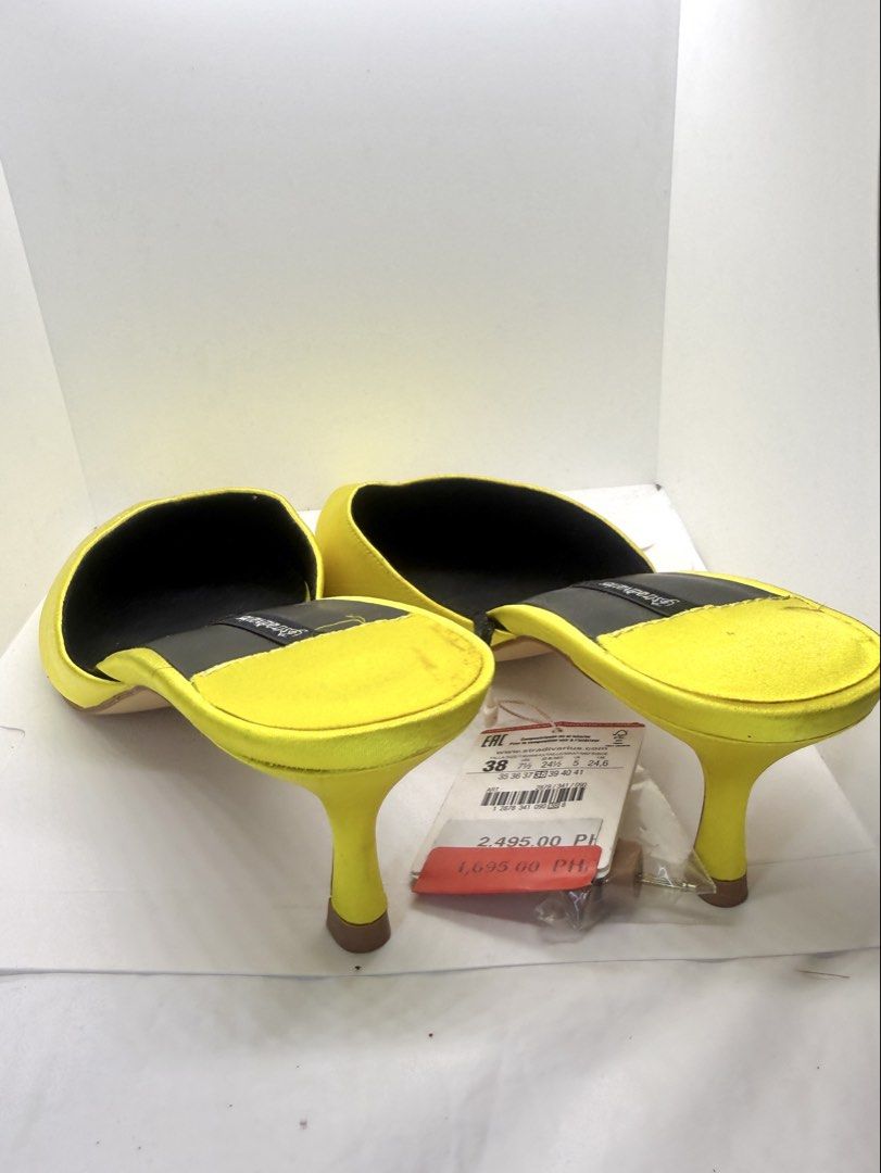 Yellow heeled mules (Category: Heels) located in Mandaluyong City. Submitted by cherryspicks (Listing ID 1457626488, Image 3). Description: Never used with tag. Comfortable height and fit . Size is 38, 7-7.5.