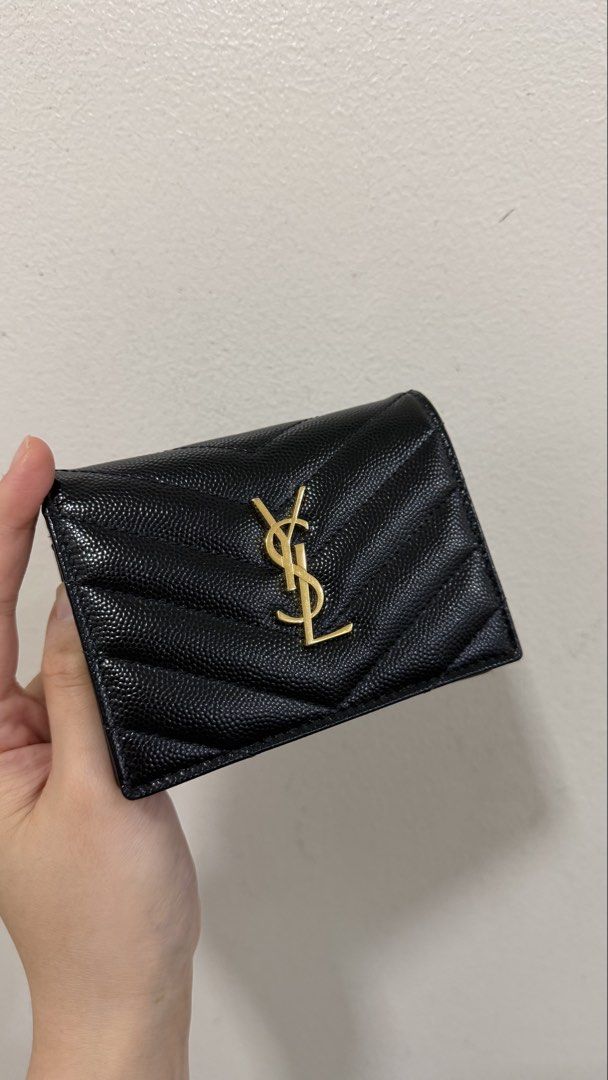 YSL Bifold Wallet in Black Pebbled Leather (Category: Luxury Bags & Wallets) located in Quezon City. Submitted by prelovedbyncy (Listing ID 1457633015, Image 2). Description: - 8.5/10 condition with hairline scratch on logo, will send pics to interested buyers - Complete with box tag and dustbag - guaranteed authentic or triple the money back, bought from Spring Fling MNL - Price is still slightly negotiable.