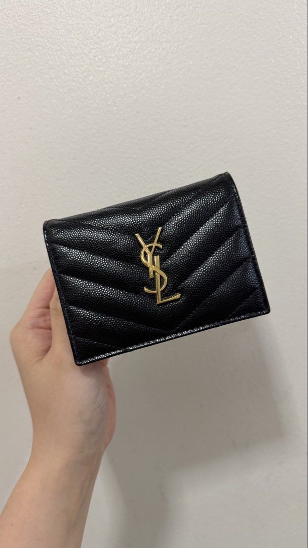 YSL Bifold Wallet in Black Pebbled Leather (Category: Luxury Bags & Wallets) located in Quezon City. Submitted by prelovedbyncy (Listing ID 1457633015, Image 1). Description: - 8.5/10 condition with hairline scratch on logo, will send pics to interested buyers - Complete with box tag and dustbag - guaranteed authentic or triple the money back, bought from Spring Fling MNL - Price is still slightly negotiable.