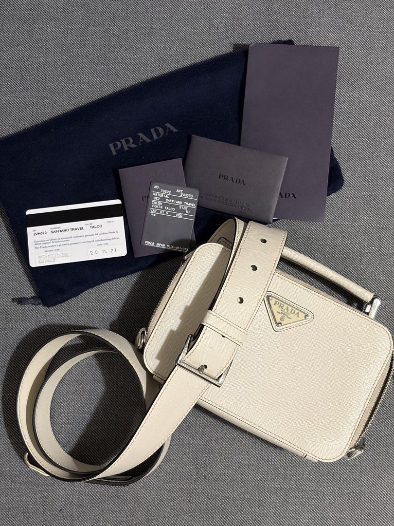 2021 Prada Brique Off-White (Category: Luxury Bags & Wallets) located in Quezon City. Submitted by thebespoketraveler (Listing ID 1457830576, Image 1). Description: 2021 Prada Brique (Small) Off-White w/ adjustable Saffiano Leather Strap Currently Discontinued 100k - White Saffiano Leather, Complete With Dust Bag, Authenticity Card, Tags, Receipt from Isetan Japan - No Box, Left it in the hotel - Bag is in excellent condition (must see to appreci