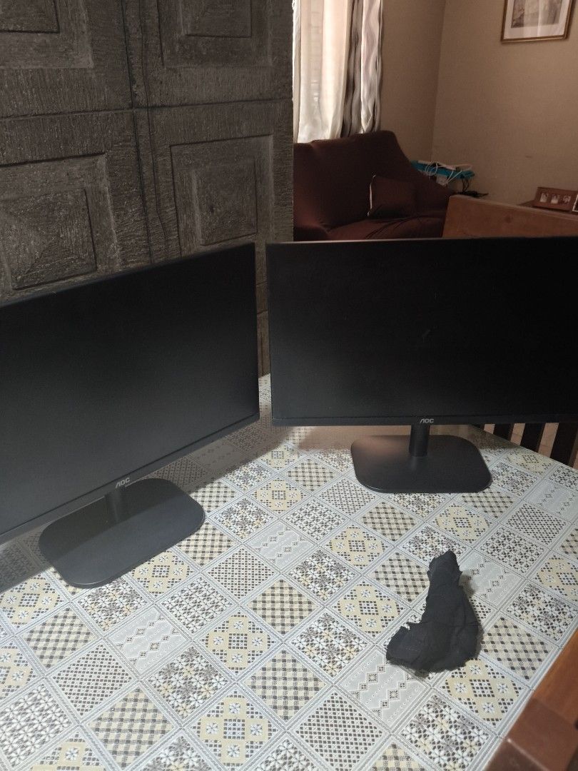 2x AOC Computer Monitors (Category: Monitor Screens) located in Manila. Submitted by fhsuaoqueyuu (Listing ID 1457792061, Image 2). Description: - Two AOC computer monitors included - Color: Black - Comes with stands - Connectivity: VGA ports - Ideal for dual screen setups or as replacement monitors - Sold as a pair.