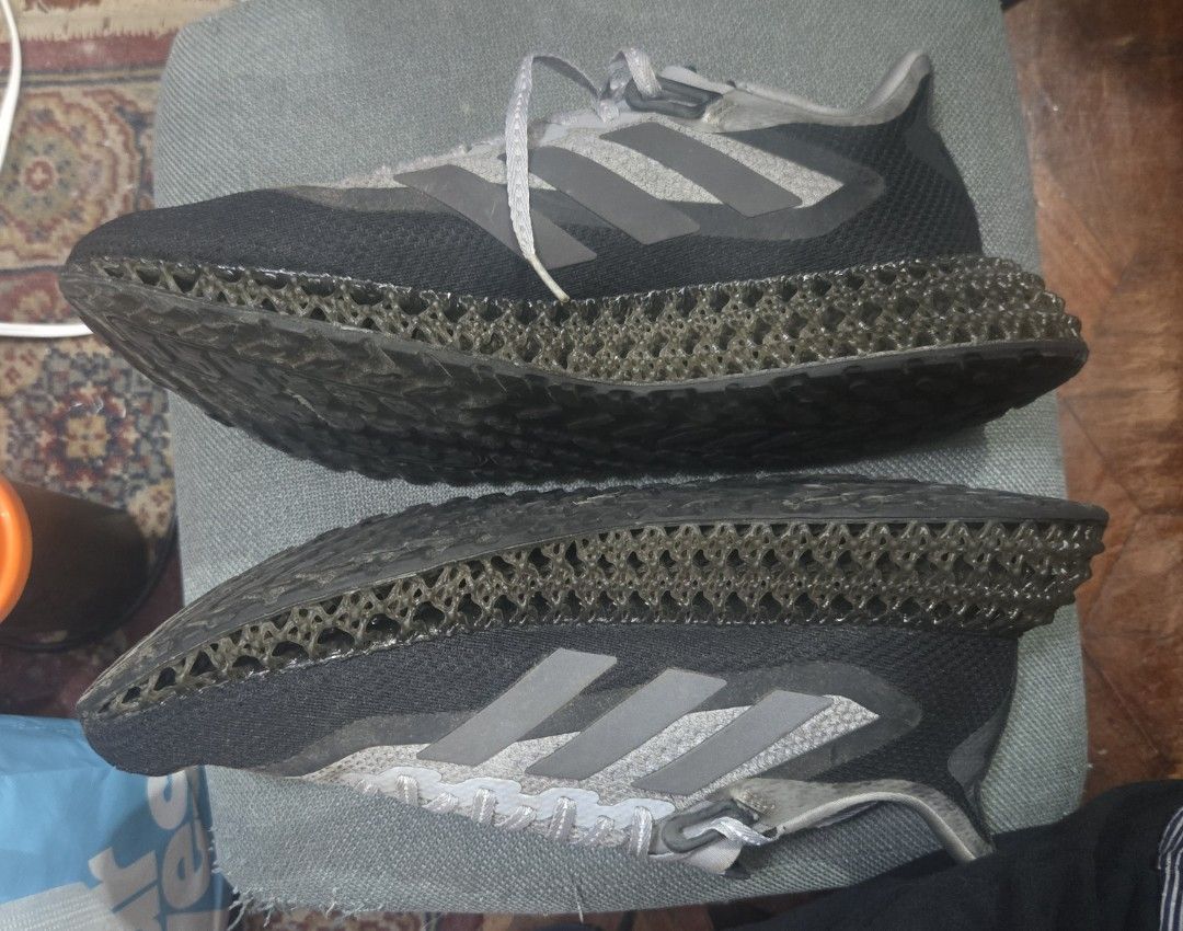 Adidas 4D Running Shoes (Category: Sneakers) located in Quezon City. Submitted by ddlry (Listing ID 1457758627, Image 3). Description: - Adidas 4D running shoes - Grey and black knit upper - Unique 4D midsole for superior cushioning - Continental rubber outsole for excellent grip - Perfect for training sessions or everyday casual wear - Note: Soles show some signs of dirt from previous use.