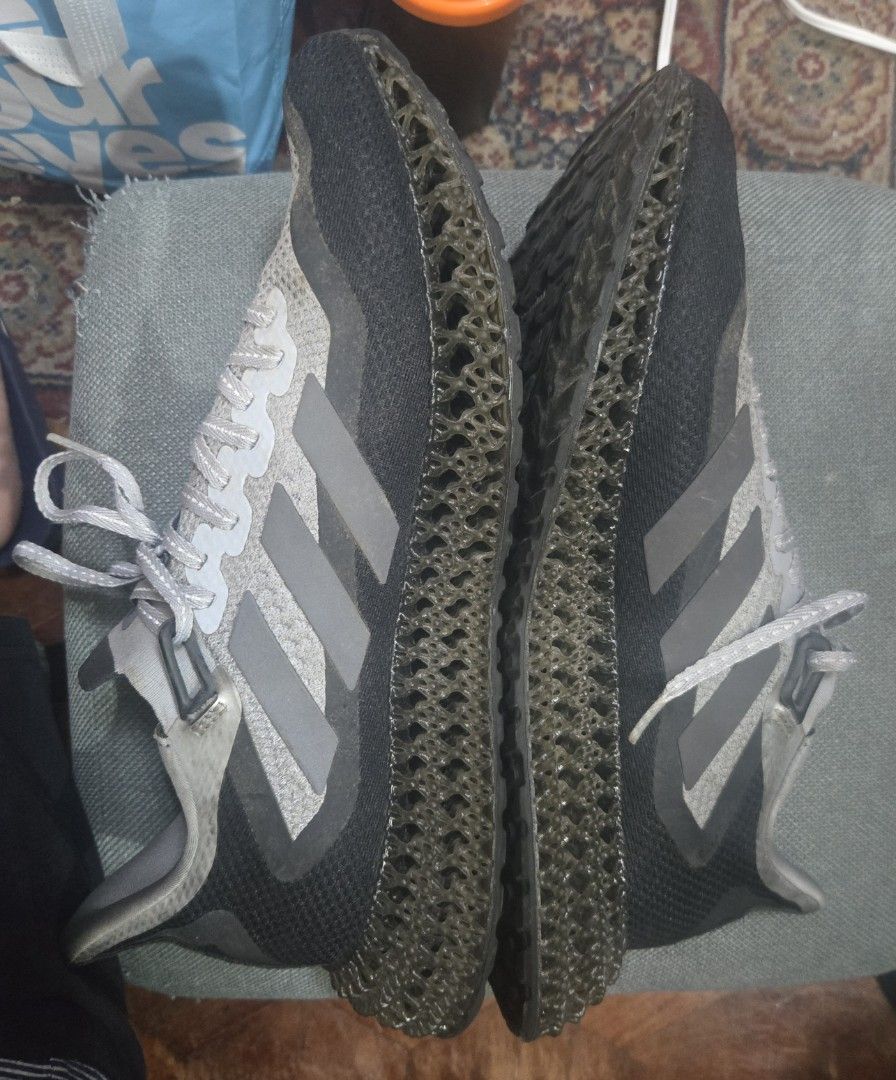 Adidas 4D Running Shoes (Category: Sneakers) located in Quezon City. Submitted by ddlry (Listing ID 1457758627, Image 2). Description: - Adidas 4D running shoes - Grey and black knit upper - Unique 4D midsole for superior cushioning - Continental rubber outsole for excellent grip - Perfect for training sessions or everyday casual wear - Note: Soles show some signs of dirt from previous use.