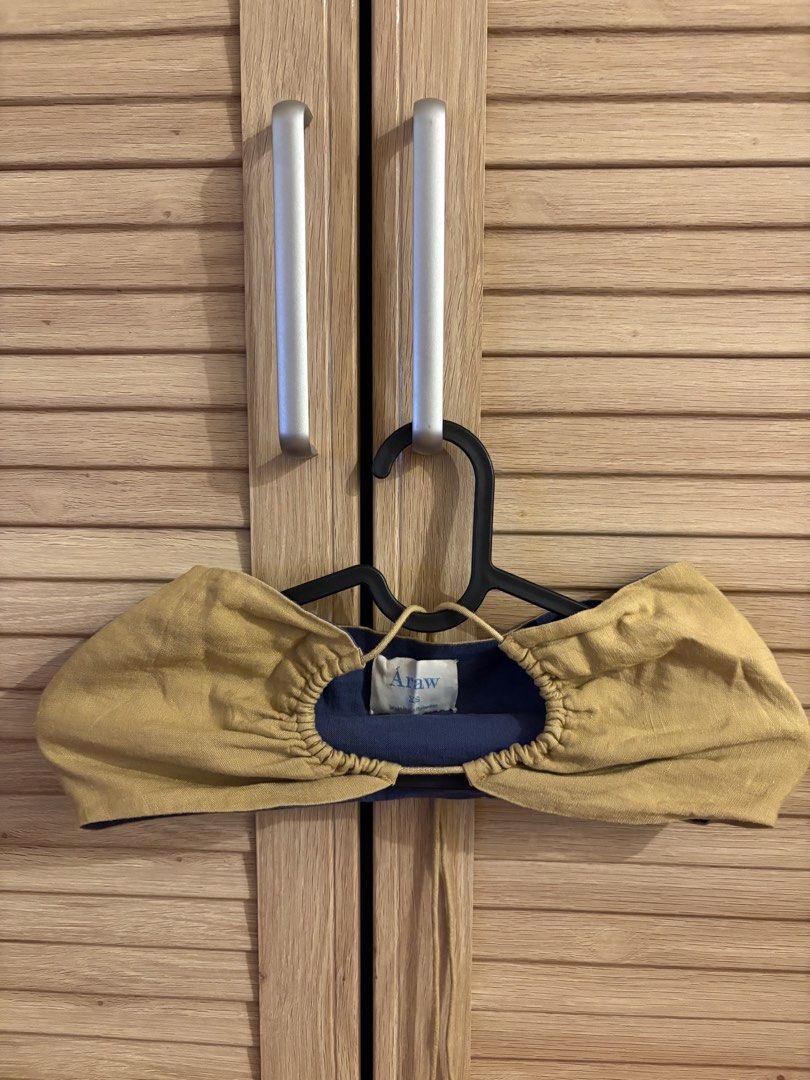Araw XS Top (Category: Sleeveless) located in Taguig. Submitted by mariajanaaa (Listing ID 1457879980, Image 1). Description: - Araw top - Size: XS - Color: Mustard yellow outer layer, navy blue inner layer - Features: Gathered neckline detail - Origin: Made in the Philippines - Versatile: Great for layering or as a standalone piece.