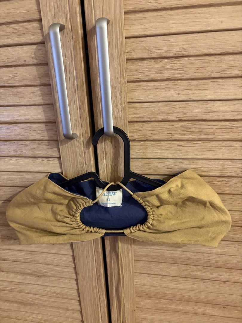 Araw XS Top (Category: Sleeveless) located in Taguig. Submitted by mariajanaaa (Listing ID 1457879980, Image 3). Description: - Araw top - Size: XS - Color: Mustard yellow outer layer, navy blue inner layer - Features: Gathered neckline detail - Origin: Made in the Philippines - Versatile: Great for layering or as a standalone piece.