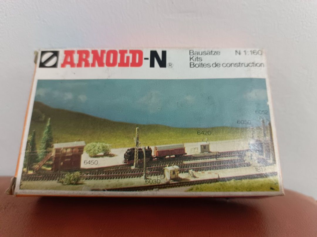 Arnold-N N 1:160 Scale Model Train Building Kits (Category: Gundam & Model Kits) located in Muntinlupa City. Submitted by kencasia (Listing ID 1457772396, Image 2). Description: - Arnold-N N scale model building kits - Perfect for N 1:160 scale model railway layouts - Includes various building kits for your village and railway scenes - Ideal for hobbyists and model train enthusiasts - Box shows wear, but contents appear to be sealed.