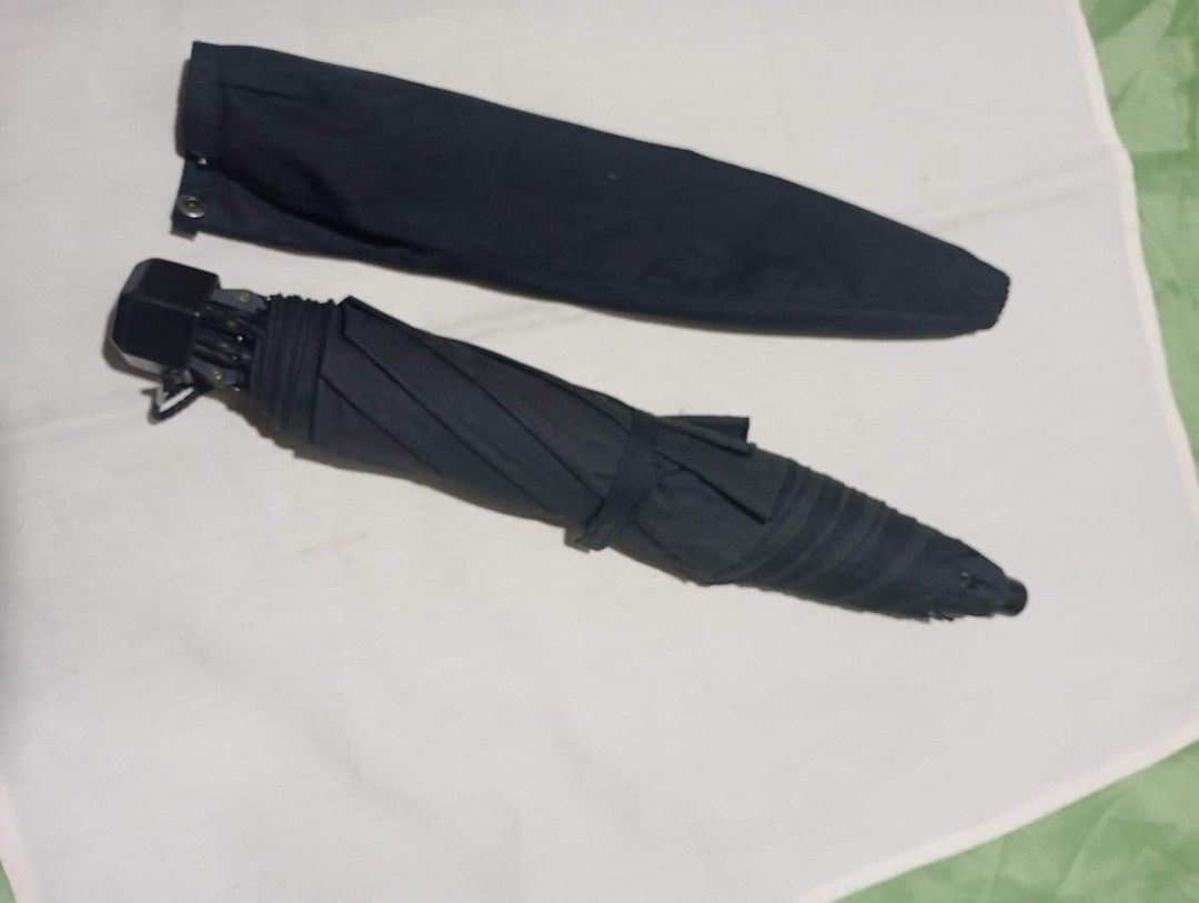 Assorted Umbrellas - Various Brands and Colors (Category: Umbrellas) located in Manila. Submitted by scherielar31543 (Listing ID 1457761303, Image 3). Description: - Foldable umbrellas - Includes: black floral, navy gingham ruffled, black compact, maroon Patrizia Ricci, and red Christian Georges - All umbrellas are functional and ready for use - Perfect for protecting yourself from the rain.