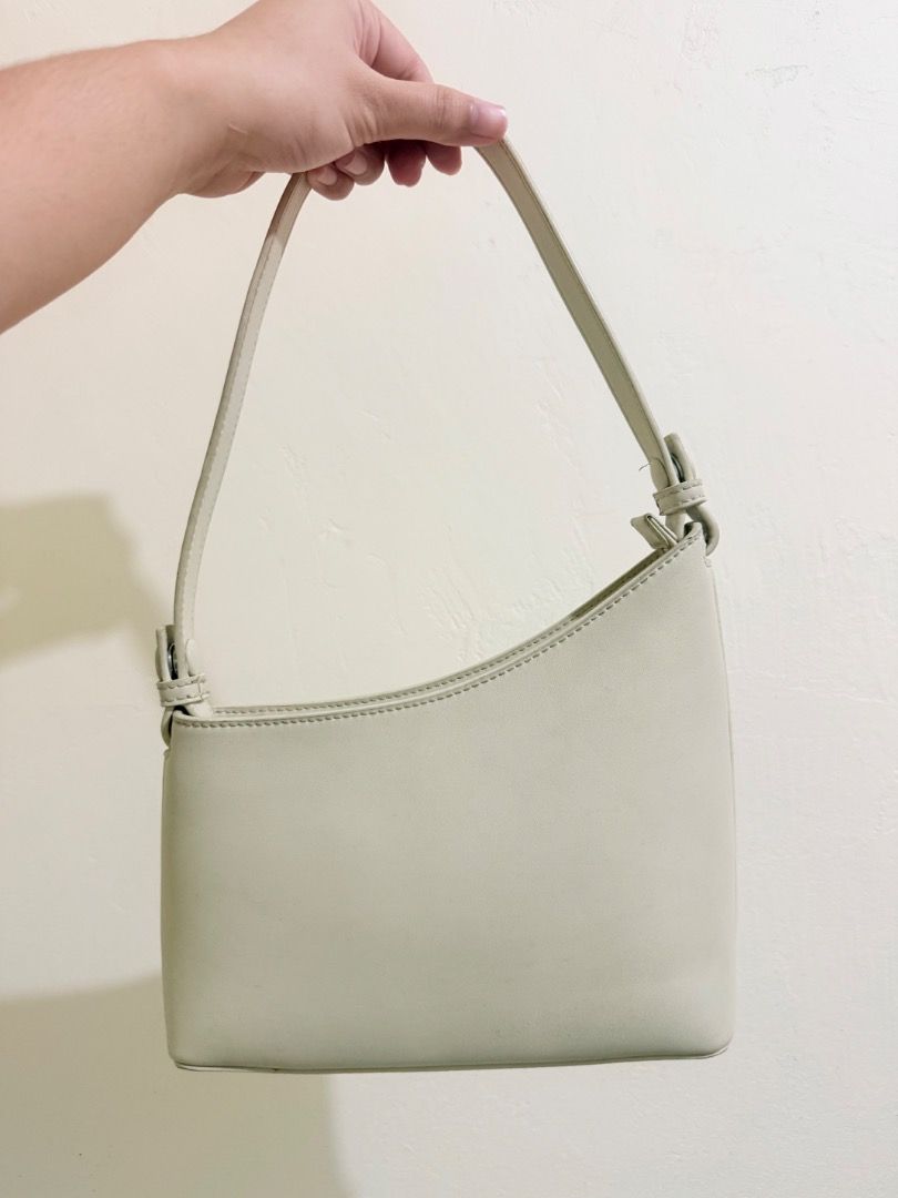 Authentic Charles & Keith - Asymmetrical Kili Bag Off-White (Category: Shoulder Bags) located in Pasig City. Submitted by romaca015 (Listing ID 1457883795, Image 2). Description: 📌Decluttering - Bags for rehome. Need space for baby stuffs. Authentic Charles & Keith - Off White Asymmetrical Kili/Shoulder Bag Perfect for everyday errands. 📍Sta Maria Bulacan 📱Gc@sh or M@ya. 🚚JNT/ Lalamove. - Brand: Authentic Charles & Keith - Material: Faux Leat
