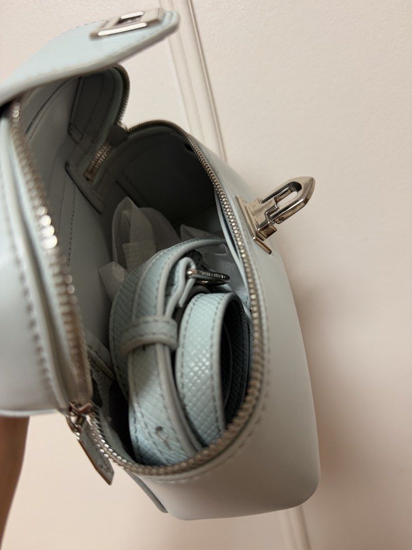 Authentic Charles & Keith Light Blue Vanity Case Bag (Category: Luxury Bags & Wallets) located in Davao. Submitted by embellished.ph (Listing ID 1457816800, Image 2). Description: ✨Light blue Charles & Keith vanity case bag ✨ Comes with a detachable strap ✨ There are minor marks and few stains on the bottom and a few small specks on the corner Feel free to message for more inquiries 💗.