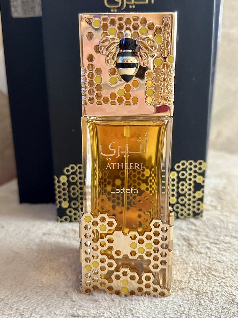Authentic Lattafa Atheeri Perfume (Category: Fragrance & Deodorants) located in Manila. Submitted by aly_tan0903 (Listing ID 1457853776, Image 1). Description: - Lattafa Atheeri Eau de Parfum - Full bottle, never used - Fragrance Profile: Warm and sweet aroma - Exquisite bottle design: Features a bee motif with honeycomb accents - Ideal for gifting or personal indulgence - A unique and captivating scent.